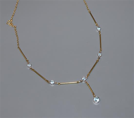 A modern 18ct gold and aquamarine set drop necklace,